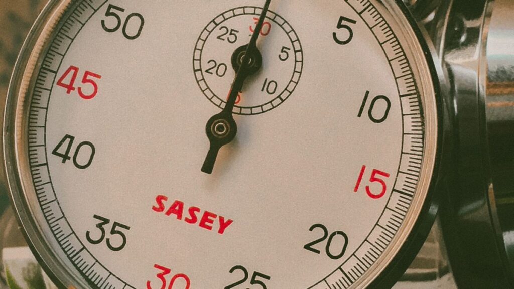 Hourglass and clock representing a one-hour loan promise