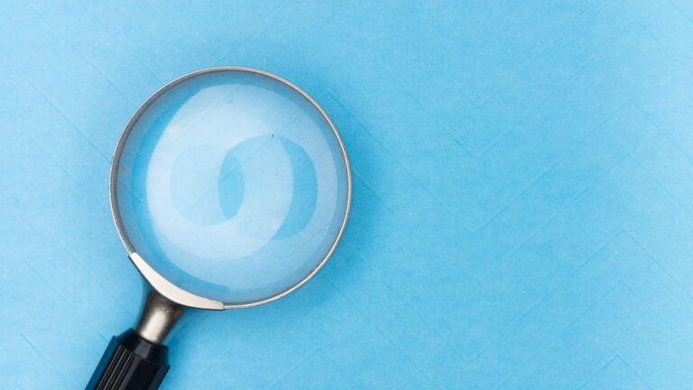 Magnifying glass over a document to check the small print