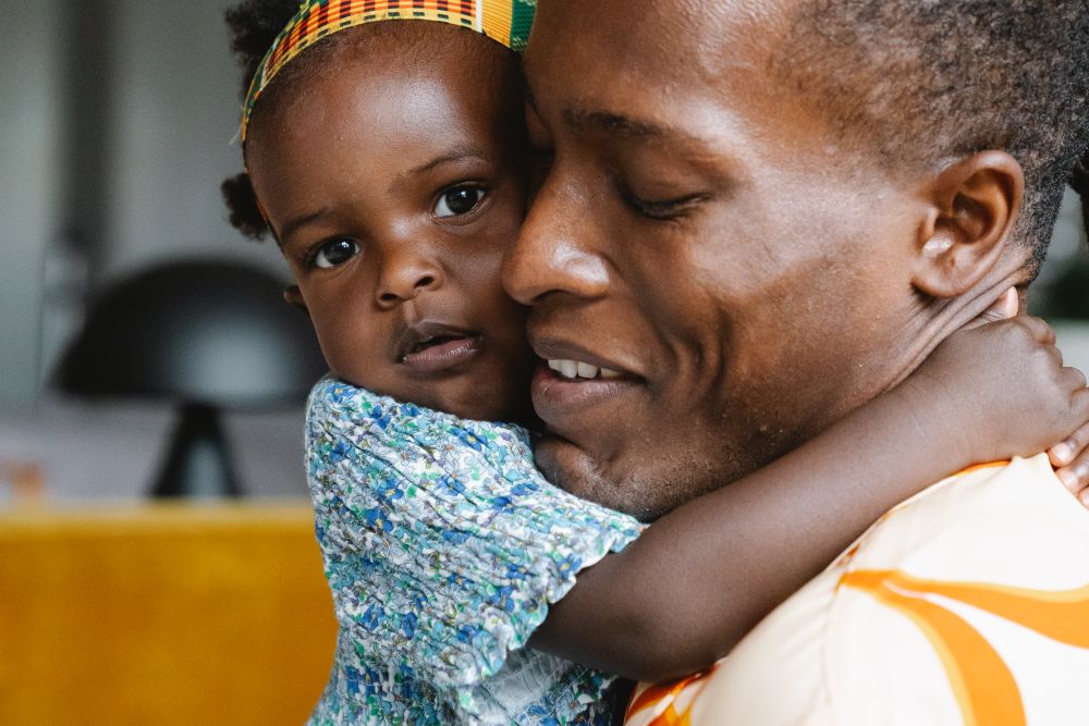 Family together at home, a family talking about black tax and a monthly giving limit