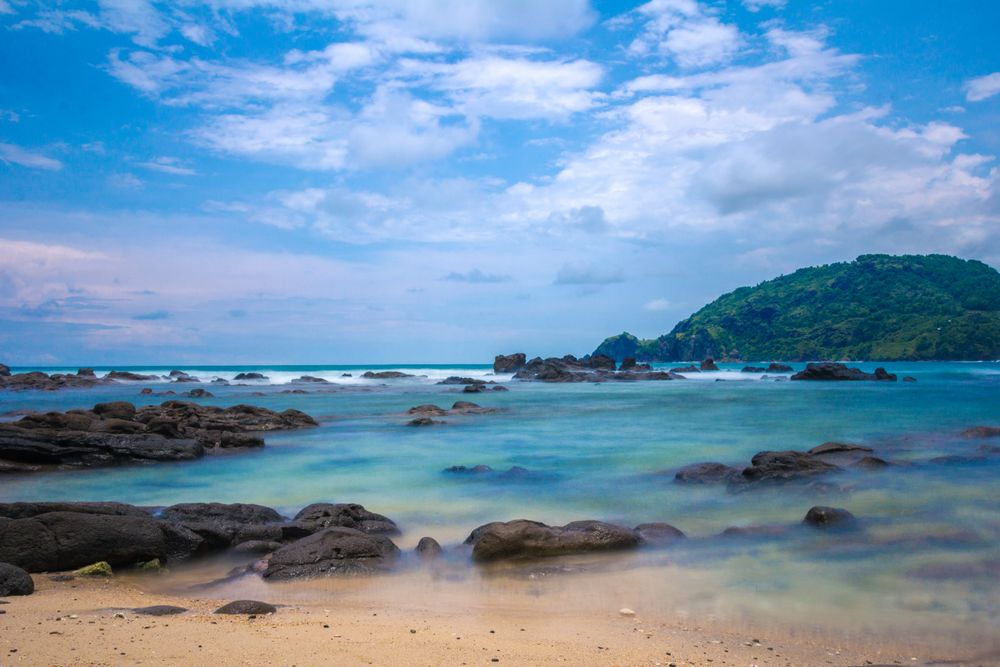 Beach holiday with sea and sand, a family planning a budget holiday by the sea