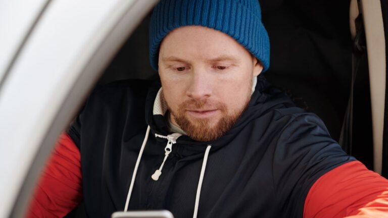 Person checking a credit score on a smartphone