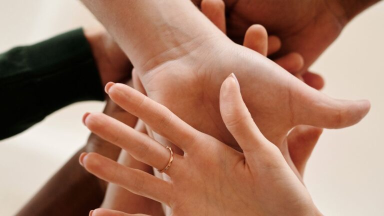 Hands offering help and support to a consumer