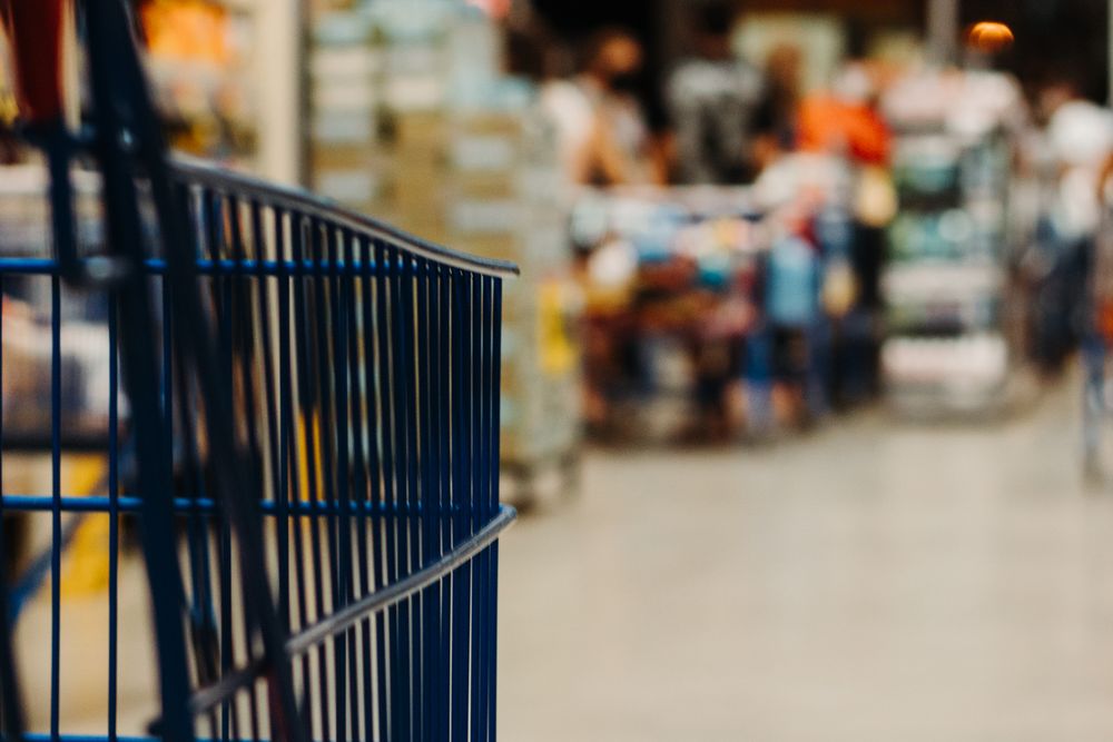 Shopping for groceries in a supermarket, where the cost of living bites first