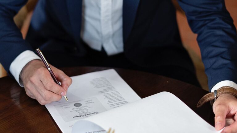 Person reading a credit agreement before signing