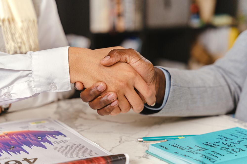Person reading and signing a credit agreement, one of the accounts a credit bureau records