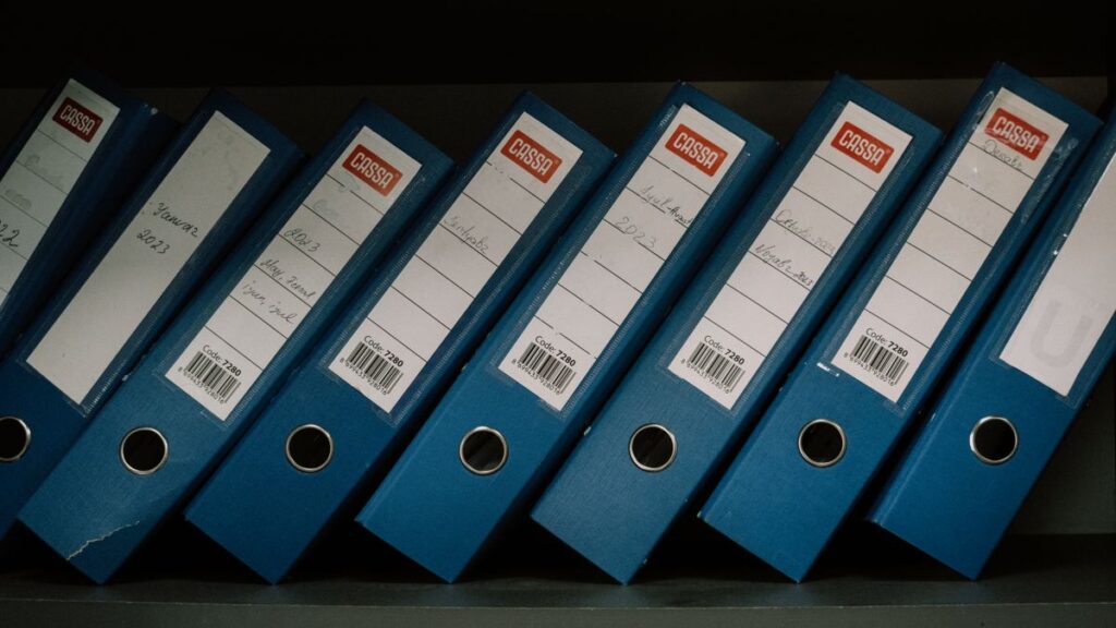 Folders and binders of financial paperwork
