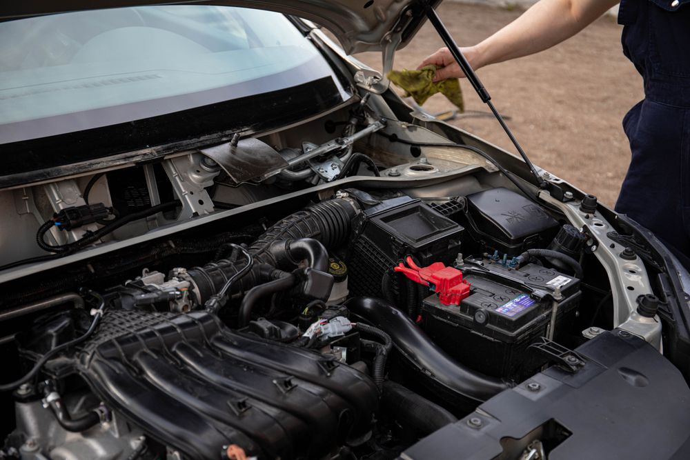 Mechanic repairing a car in a workshop