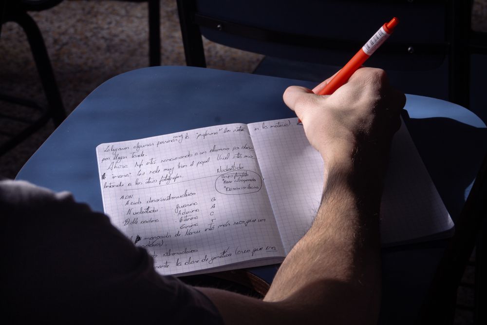 Person reading and signing a credit agreement, the kind of record a free credit report shows