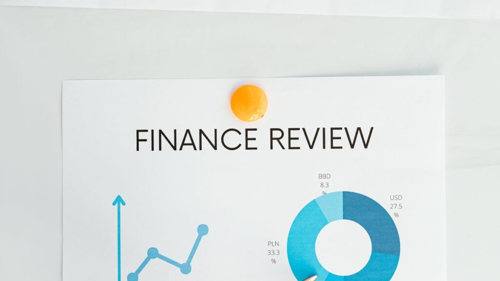 Chart and report on a desk showing a credit score range