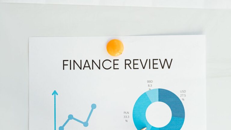 Chart and report on a desk showing a credit score range