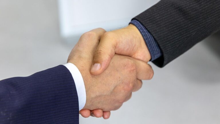 Handshake over an agreement after a lender approves an application