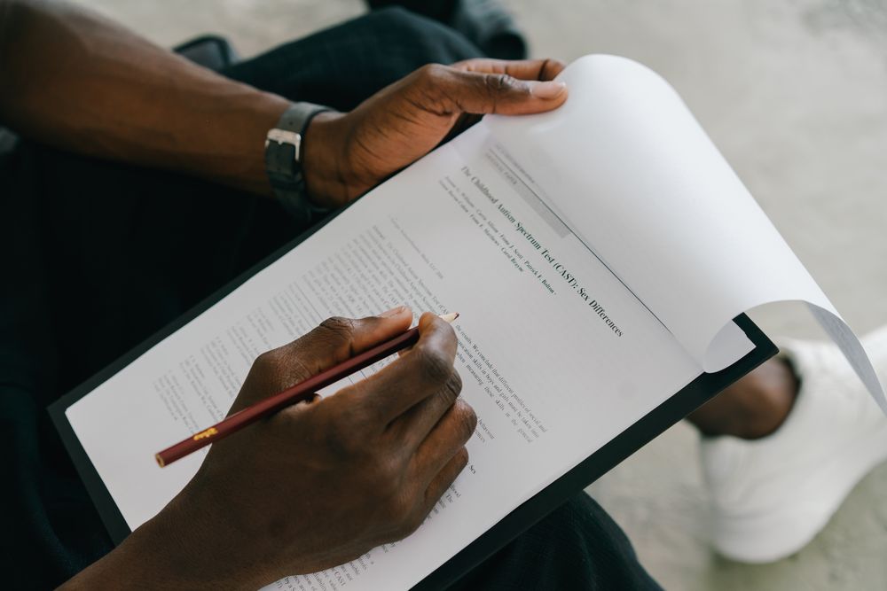 Person reading and signing a credit agreement, the step that follows an affordability check
