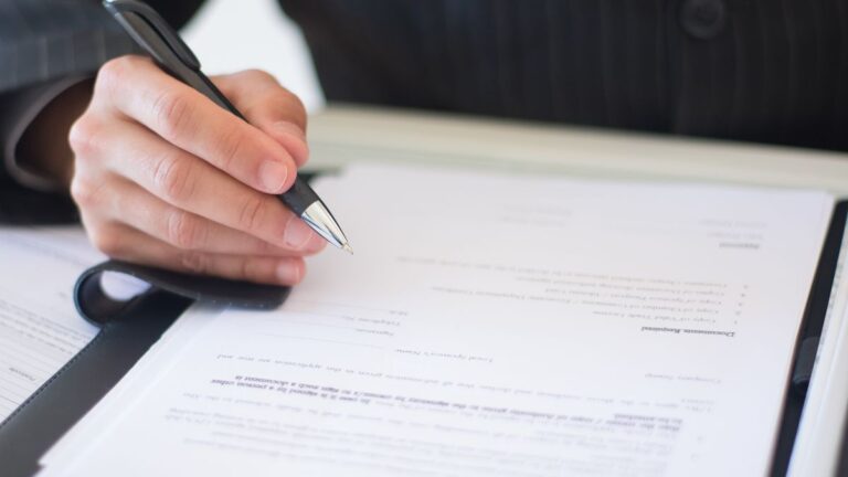 Person reading a loan agreement with fixed monthly instalments