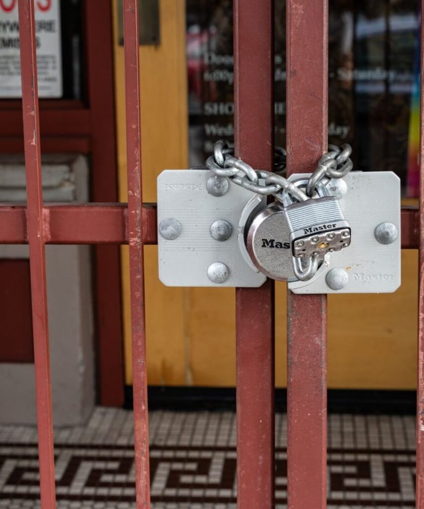 Padlock and chain securing a gate, representing data protection