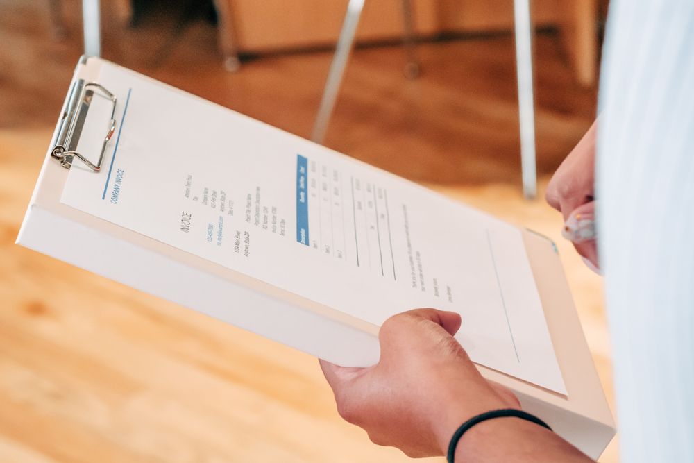 Invoices and paperwork being reviewed