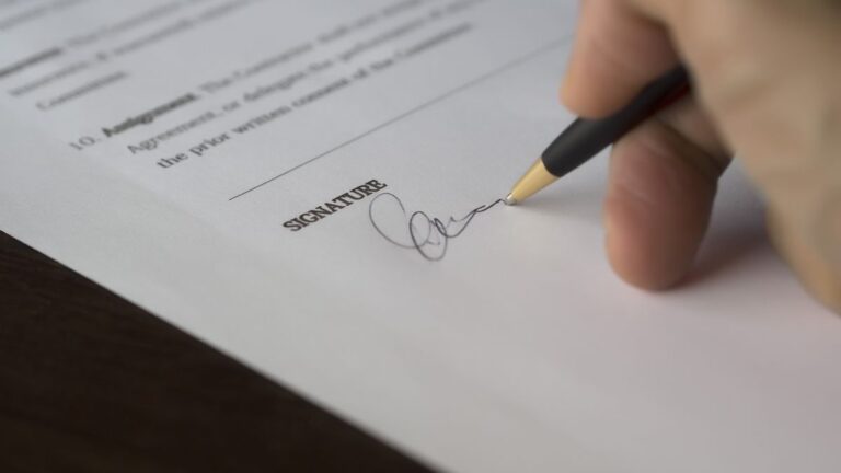 Documents and a pen on a desk for a loan application