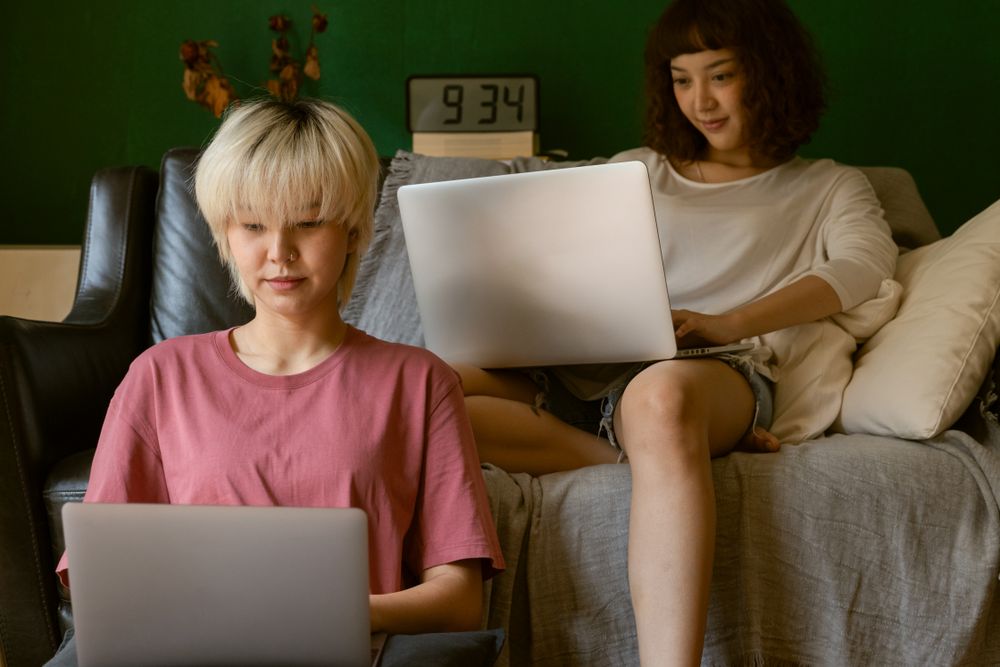 Person working on a laptop at home, uploading documents securely when you apply for instant cash loans