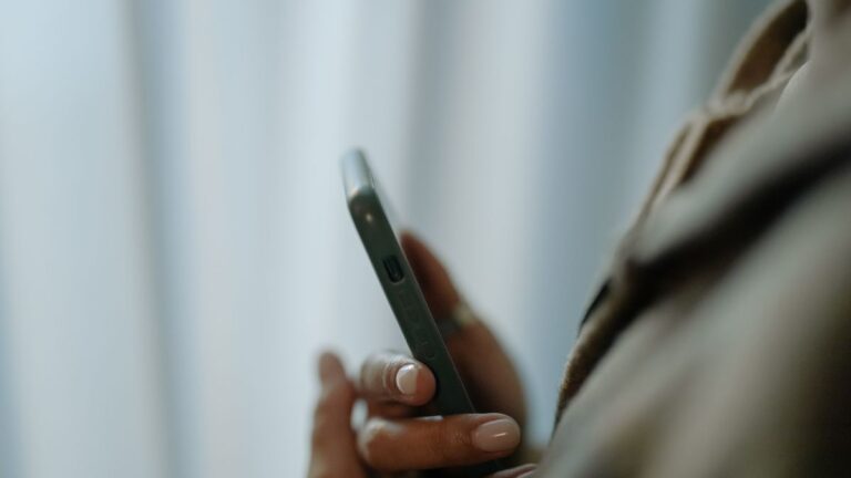 Hands holding a smartphone, representing instant loan apps