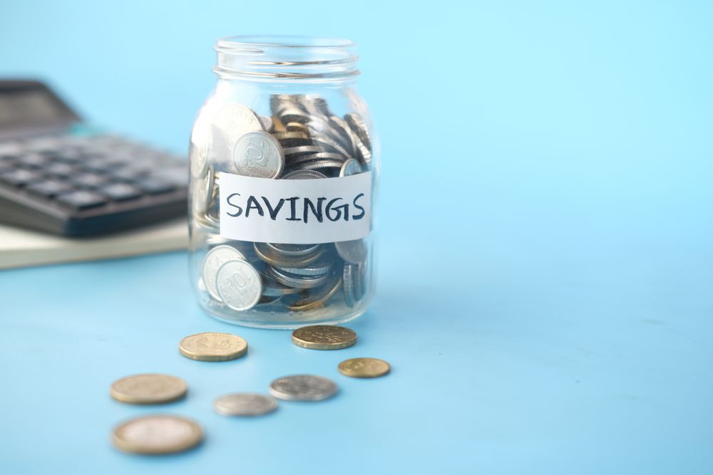 Savings jar and a savings tracker, a cheaper habit than relying on instant cash loans