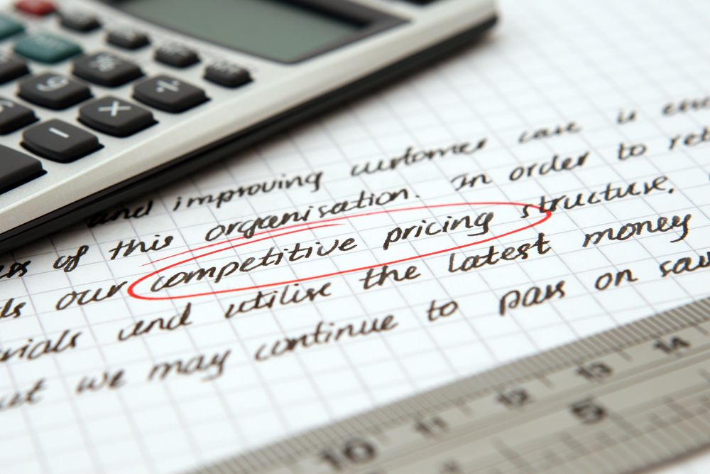Financial goals and notes on a desk, comparing an interest rate across loans