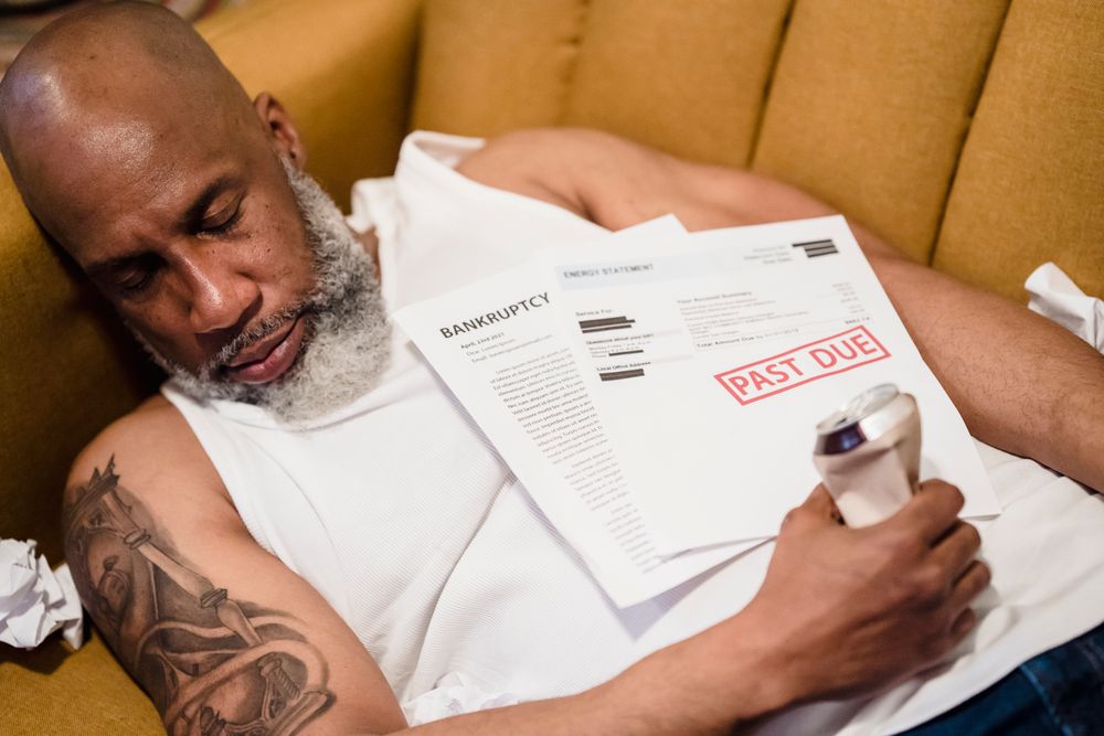 Person stressed over overdue bills, a parent worried about Januworry bills