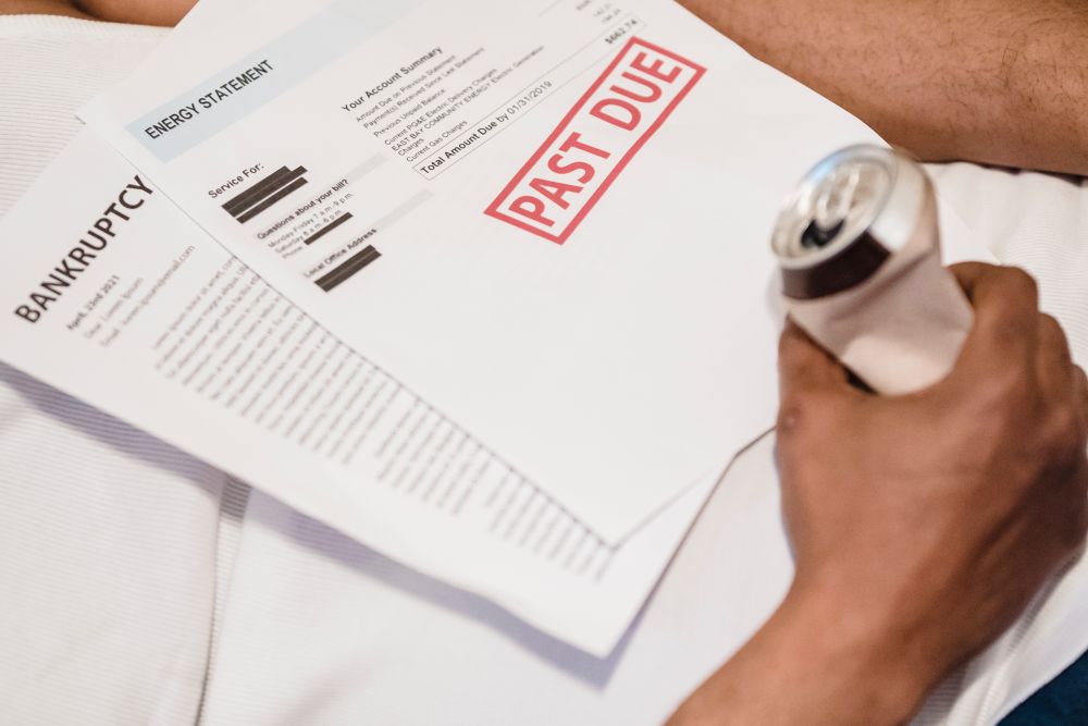 Person stressed over overdue bills, the pressure that a loan shark relies on