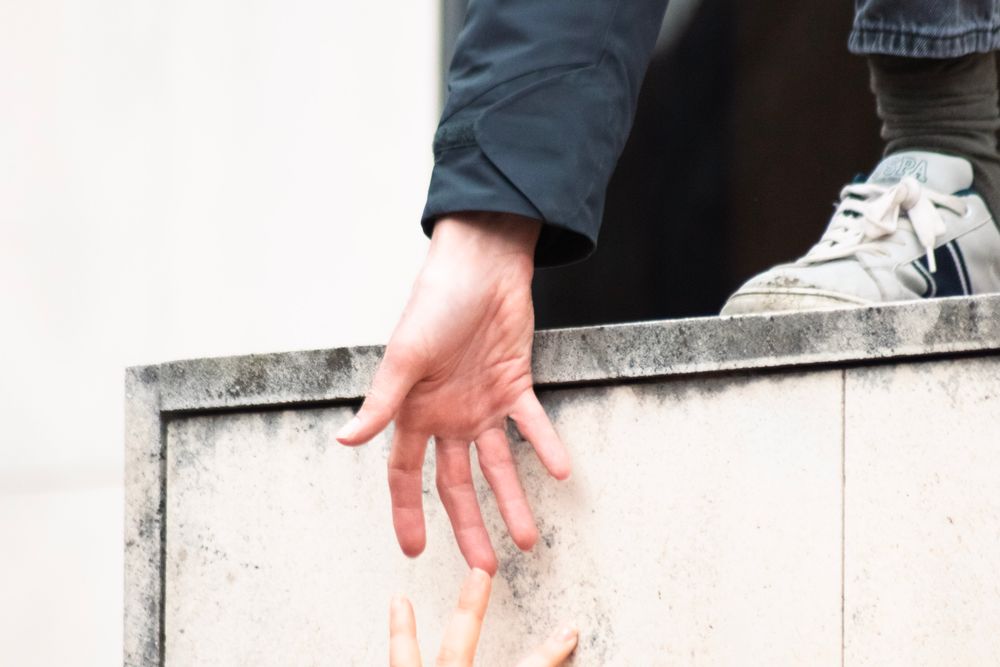 Hands offering help and support