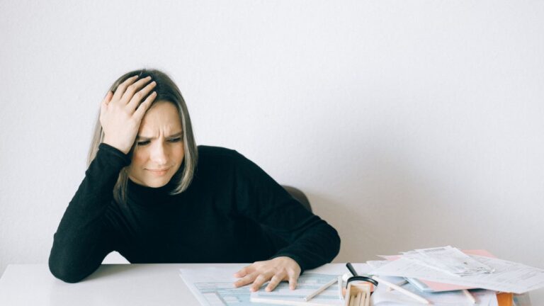 Person worried about a loan application with a poor credit record