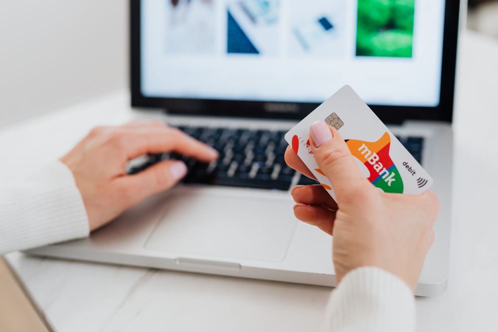 Person managing online banking on a laptop