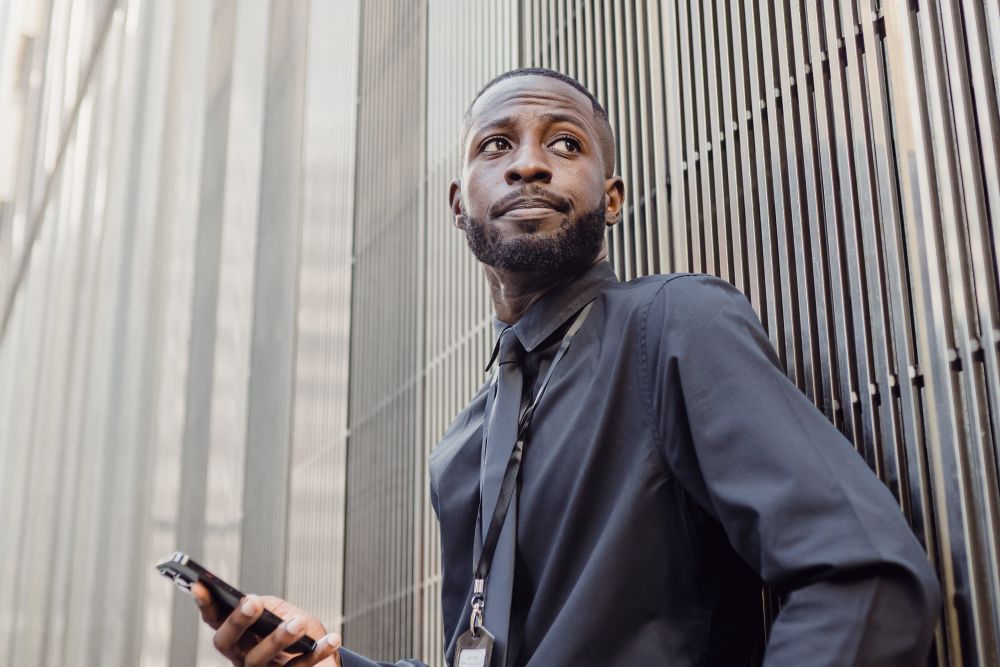 Man working on a laptop, looking for work online while exploring loans for the unemployed