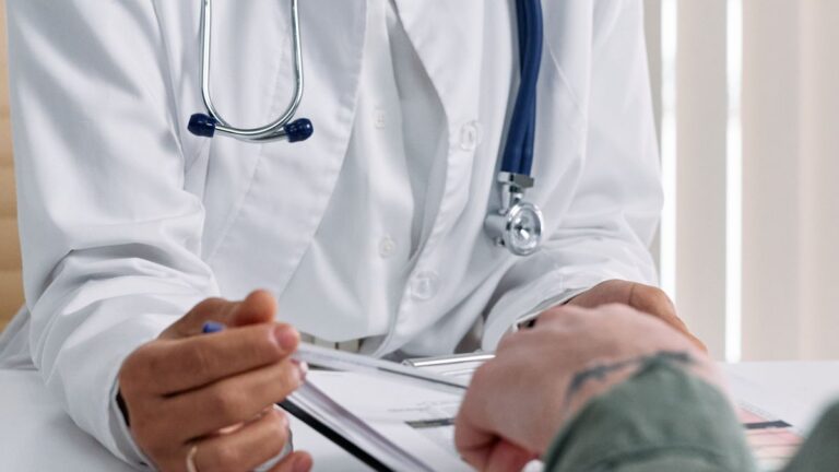 Doctor consulting with a patient about treatment costs