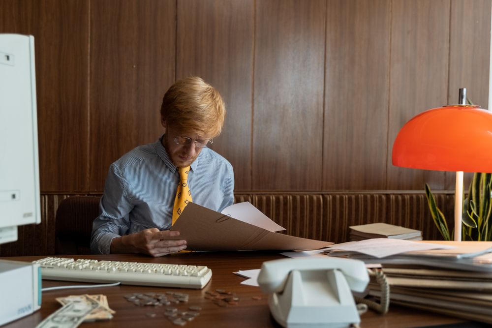 Person going through bills and receipts at a table