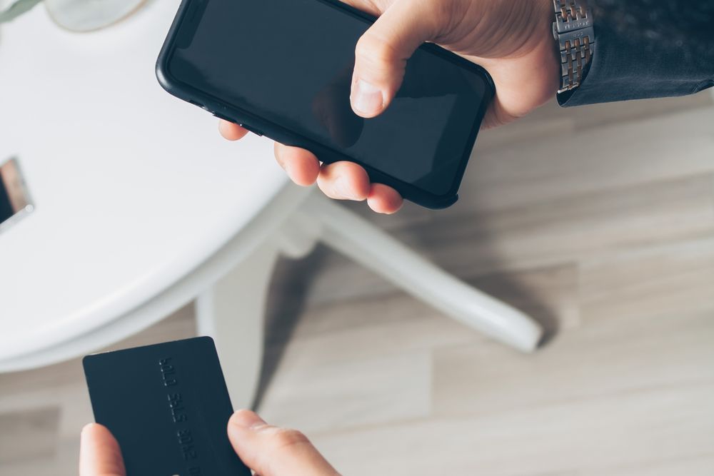 Person using a banking app on a smartphone to apply for quick loans same day