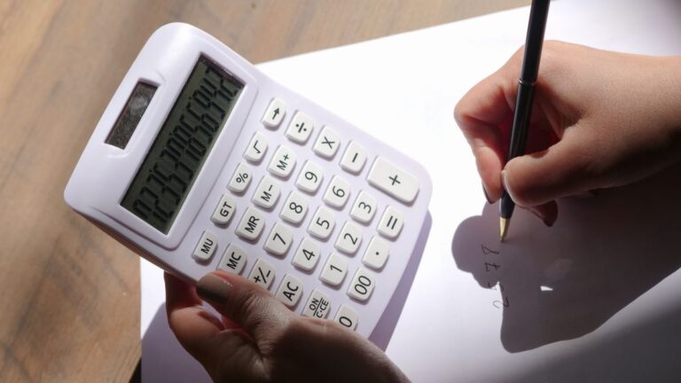 Calculator and receipts used to work out what a small loan costs