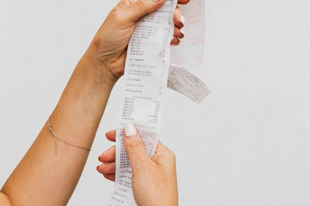 Receipts and expense notes, adding up what a R2000 loan really costs