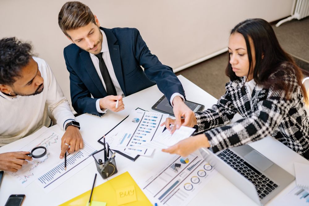 Client meeting with a financial adviser, discussing how to remove a default from a credit record