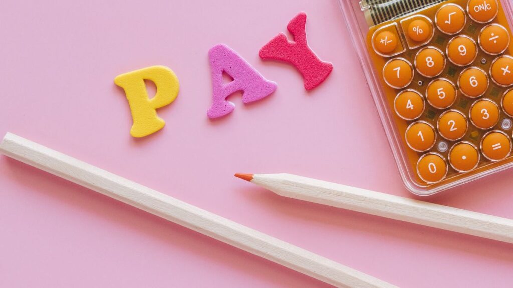 Payroll papers on a desk representing a salary advance