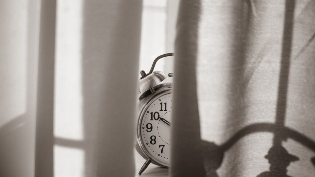 Clock and hourglass representing fast loan decisions