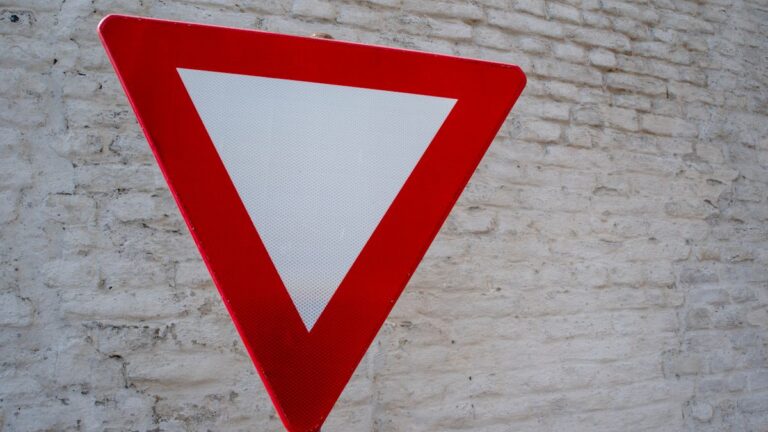 Stop sign warning against paying upfront fees