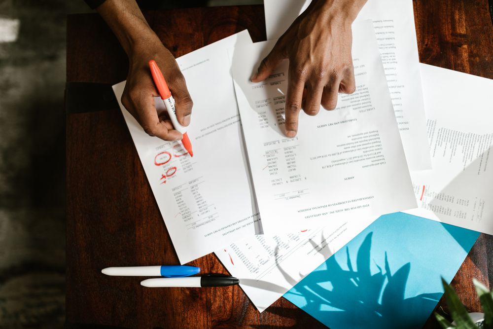 Invoices and paperwork being reviewed, the line-by-line check every fee on same day loans deserves
