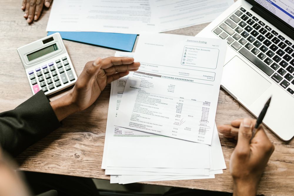 Invoices and paperwork being reviewed