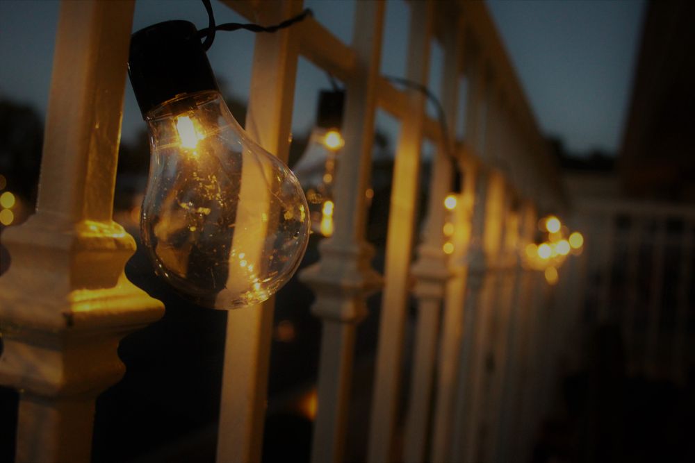 Light bulbs and electricity meters showing household power costs, a meter reading to help you save electricity at home