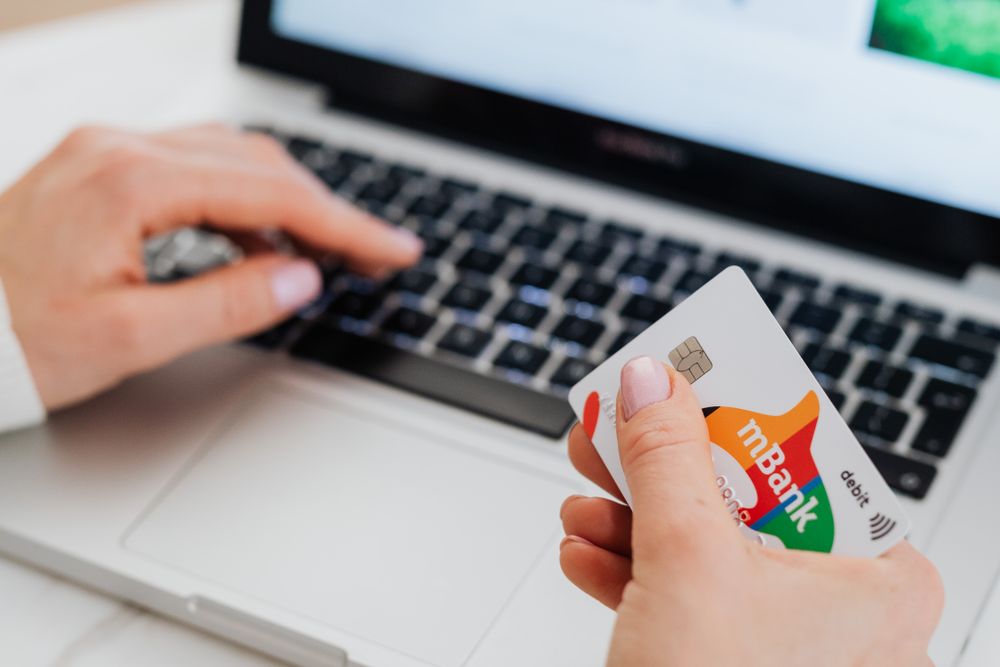 Person managing online banking on a laptop