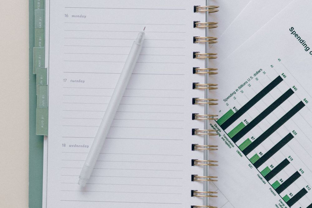 Financial goals and notes on a desk, planning a sinking fund for known costs