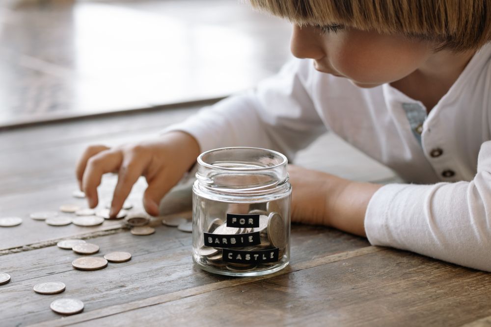 Jar with a plant growing from coins, showing savings growth, tax-free savings growing over time