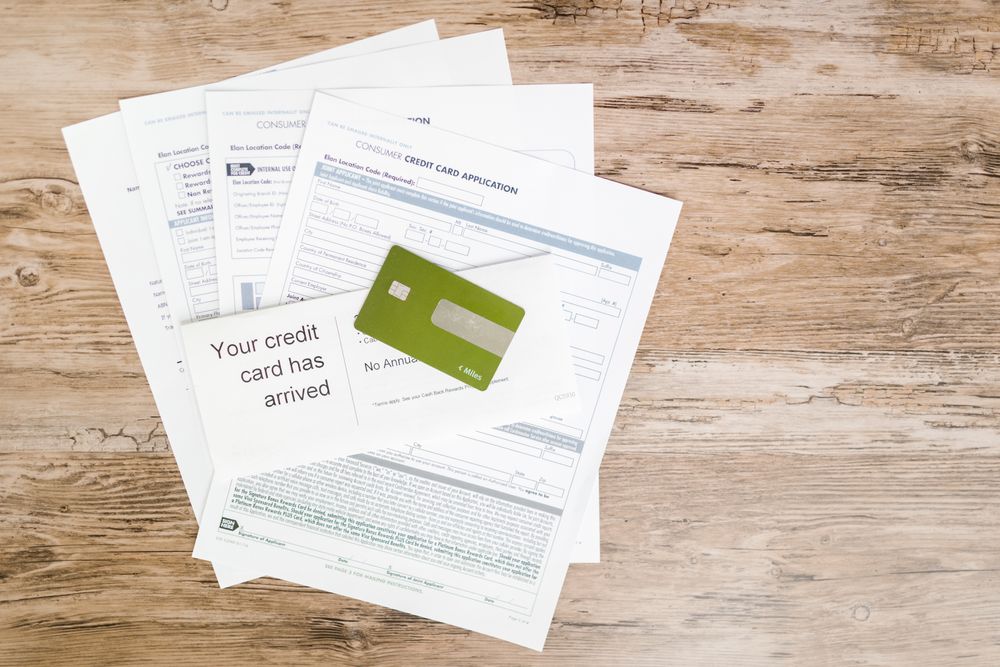 Tax and payslip documents on a desk with a calculator, gathering documents for tax season