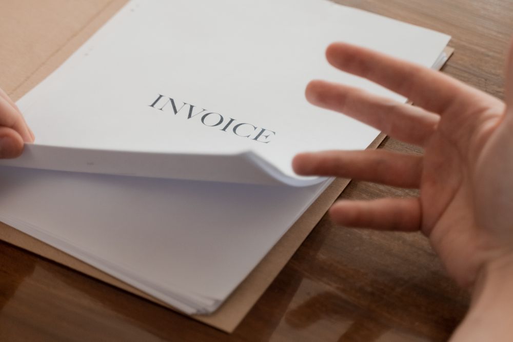 Invoices and paperwork being reviewed