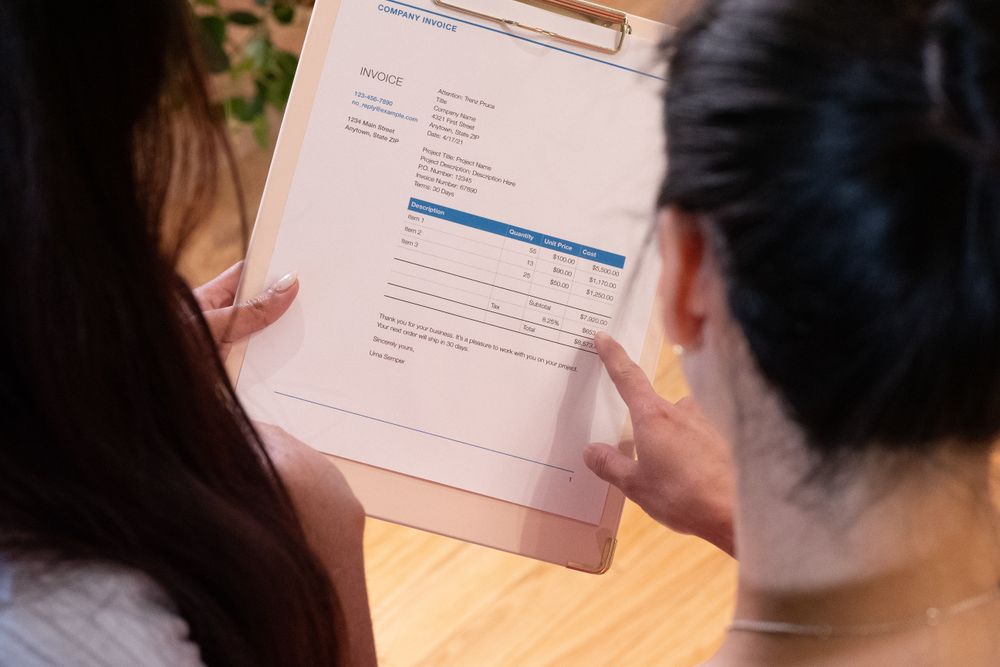 Invoices and paperwork being reviewed