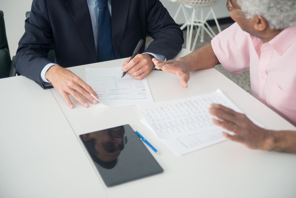 People meeting an adviser to talk about money