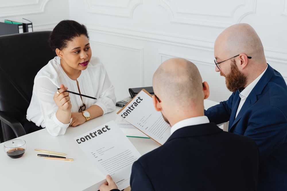 Person signing a contract, signing for unsecured loans means promising to repay from your income